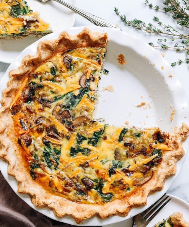 Homemade gluten free quiche with a flaky golden crust and creamy savory egg filling.