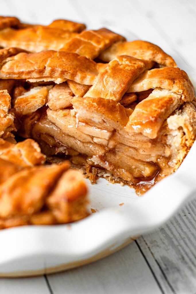 Homemade gluten free apple pie with a flaky golden crust and cinnamon-spiced apple filling.