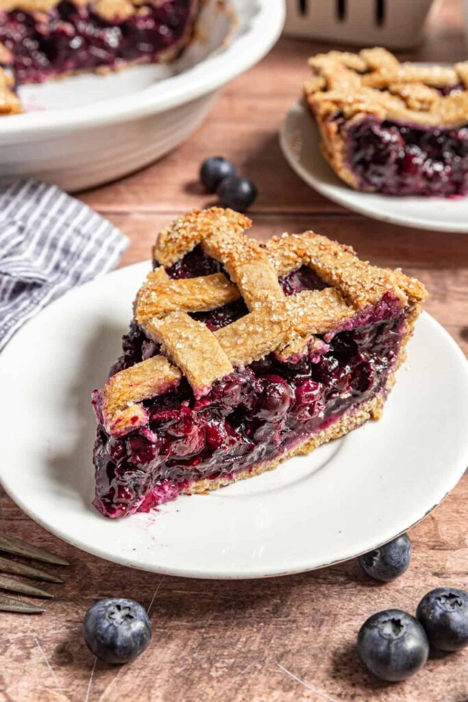 Juicy gluten free blueberry pie with a flaky golden crust and fresh blueberry filling.